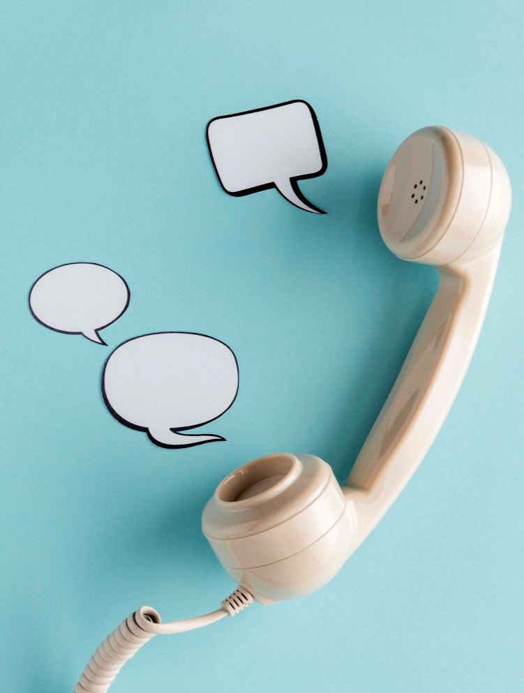 top-view-chat-bubbles-with-telephone-receiver-copy-space
